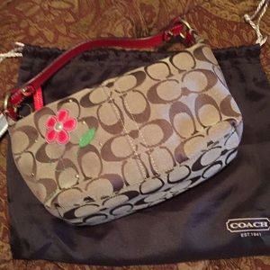 Authentic Coach small handbag w/ red flowers